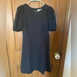 Lark & Ro black dress with delicate ruffle detail on sleeve. Size 4.